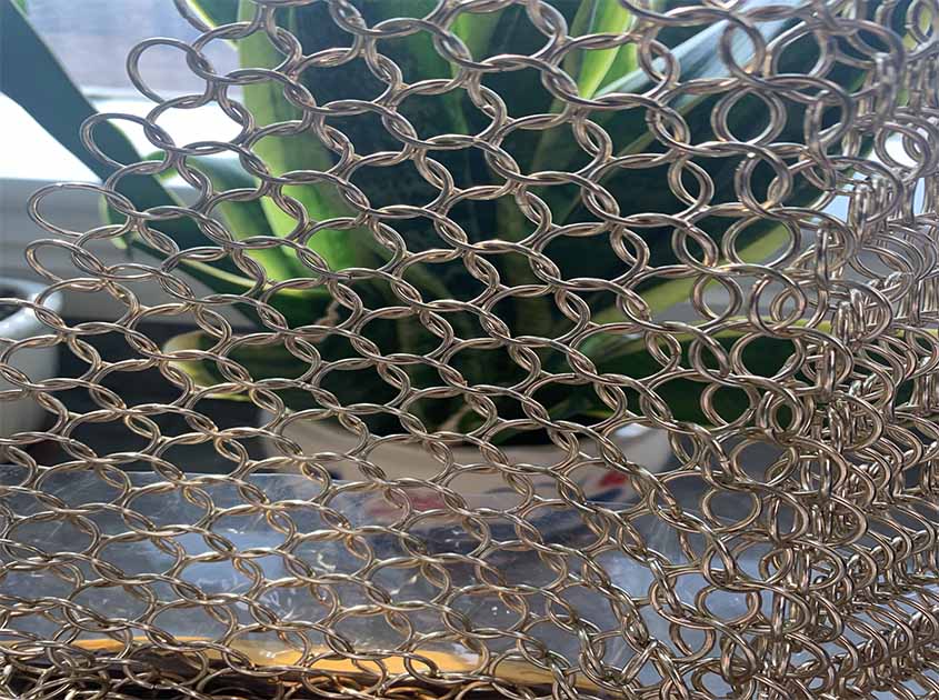 Shape spaces with woven metal interiors with metallic ingenuity